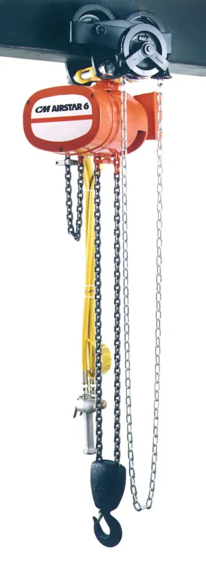 An orange CM Airstar 6 chain hoist suspended from a beam, with visible chains, gears, and a large black hook hanging below.