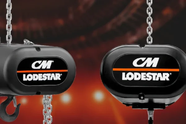 Two black CM Lodestar chain hoists are shown hanging, with chains visible, against a blurred red and black background.