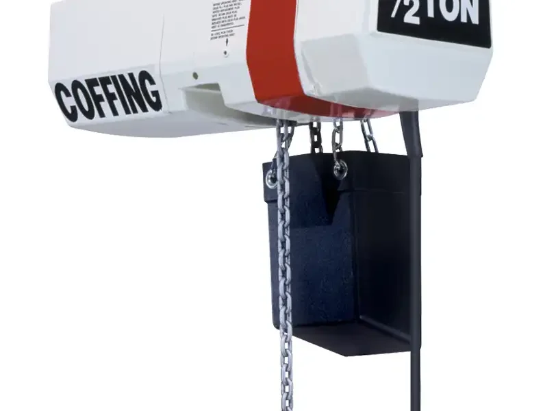Electric chain hoist labeled "Coffing 1/2 ton," mounted on a rail, with a hanging chain, hook, and red handheld control.