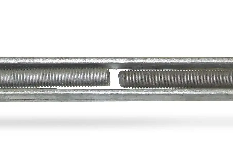 A metal turnbuckle with a hook on one end and an eye on the other, used for adjusting tension or length in cables, ropes, or tie rods.