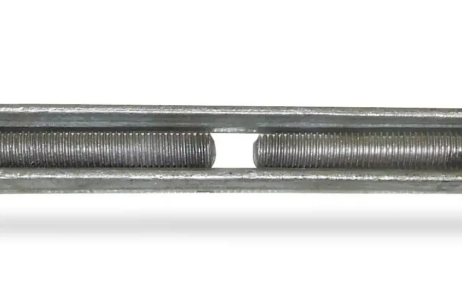 A metal turnbuckle with threaded rods and clevis ends, used for tensioning and adjusting length in cables and rigging systems.
