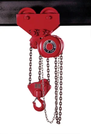 A red manual chain hoist with a 5-ton capacity is suspended from a black beam, featuring a hook and heavy-duty chains for lifting.