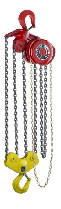 A red and yellow chain hoist with metal chains hanging down, used for lifting heavy objects.