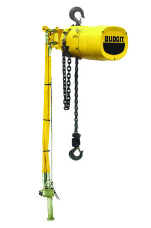 A yellow Budgit electric chain hoist with upper and lower hooks, control pendant, and black lifting chain suspended below.