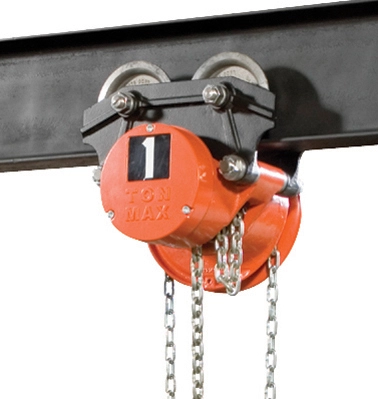 Close-up of a manual chain hoist with a labeled 1-ton maximum capacity, mounted on a steel beam with wheels for movement.